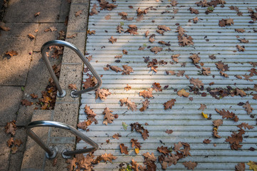 Closed swimming pool in autumn symbolizing summer season is over