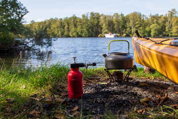 Camping stove an canoe at the lake