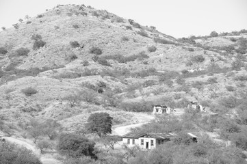 Buildings below a hill in Ruby, Arizona