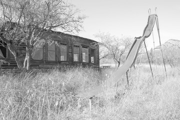 Slide outside of old school house, Ruby, Arizona