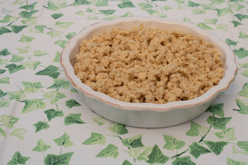 Prepare a rhubarb and strawberry pie in a white bowl