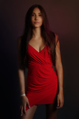 Pretty young beauty woman in red dress