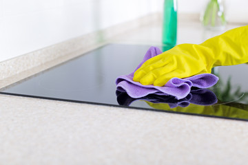 Woman cleaning induction top