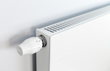 White radiator with a thermostat