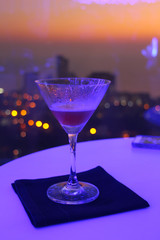 Cocktails on Balcony of Skycraper with Sunset