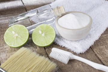baking soda and lemon on wooden table