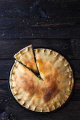 Greek Pie Spanakopita with Spinach and Cheese, top view, copy space.
