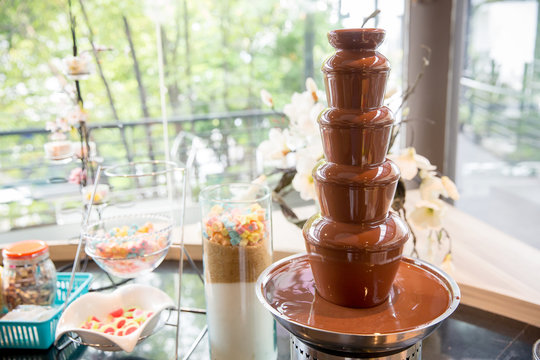 chocolate fountain for fondue. Sweets of Swiss. chocolate melt for dipping. image for background, wallpaper, copy space and menu list.
