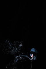 Blue smoke with random shapes agains black background