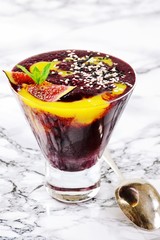 Blueberry and mango smoothie with figs and sesame seeds