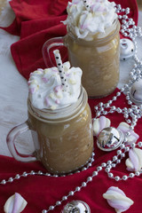 A delicious chocolate drink with tasty marshmallows on a christmas theme.