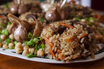 Traditional Uzbek food. Meat and rice plov meal