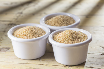 amaranth beans in bowl, on rustic wooden background