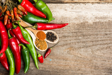 chili pepper, Various spices on old wooden, room for text. toned image. light effects 