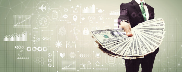 Travel theme with business man displaying a spread of cash