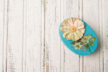 Shabby chic rustic gift box on cracked painted woden boards