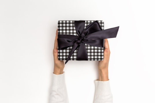 Woman Holding A Gift Box On A White Background