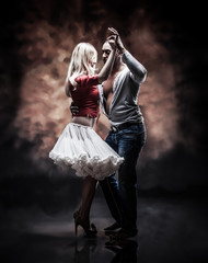 Young and saxy couple dances Caribbean Salsa