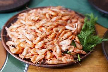 Shrimp. Shrimps lie on a plate. Boiled ready-to-eat shrimp. A large dish of small shrimps