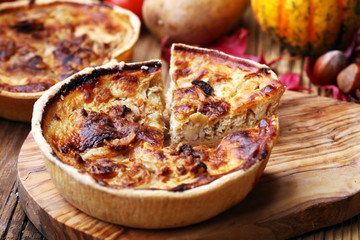 Homemade Cheesy Egg Quiche for Brunch with Spinach and Tomato, onions and zucchini.