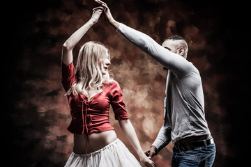 Young and saxy couple dances Caribbean Salsa