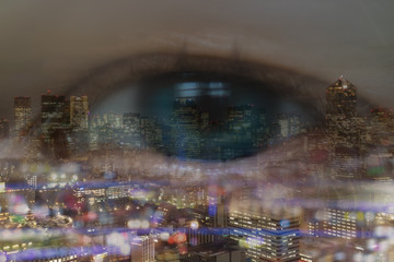 Obraz premium double exposure of business concept, business eye man look trough the cityscape or landscape in the city with bokeh light