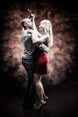 Young and saxy couple dances Caribbean Salsa