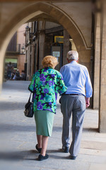 Mature couple resting in old sity