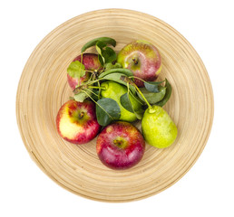 Ripe fruit on wooden plate