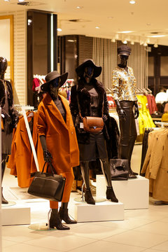 Mannequins And Fashion Accessories In Shop Window Showcase Of Store Mall Market.