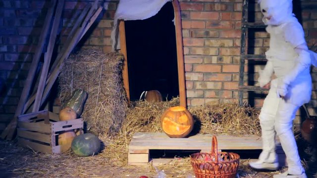 A boy mummy collects candies in a basket