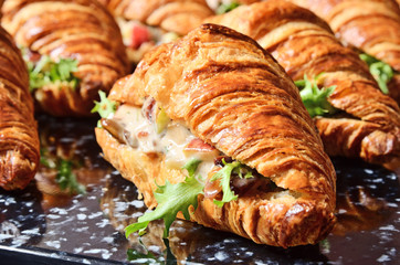 Chicken salad croissant sandwich on buffet table
