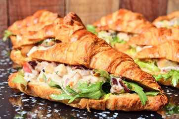Chicken salad croissant sandwich on buffet table