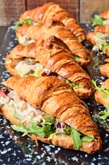 Chicken salad croissant sandwich on buffet table