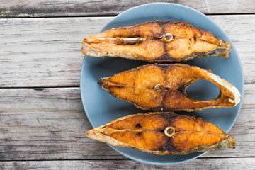 Deep fried fish on wooden table