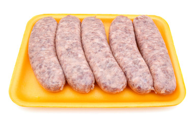 Raw meat sausages isolated on white background