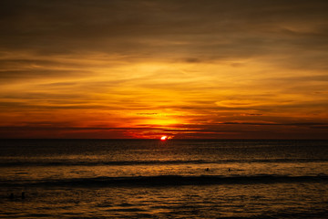 Fototapeta na wymiar Deep and Rich ORange Sunset at Karon Beach