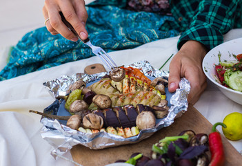 Baked, grilled, roasted vegetables in foil with tartar white sauce. Eggplants, mushrooms, red bell pepper, potato