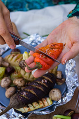 Baked, grilled, roasted vegetables in foil with tartar white sauce. Eggplants, mushrooms, red bell pepper, potato