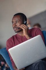 Customer Service agent in an startup office with laptop