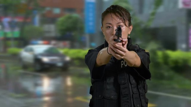 Asian American Woman Police Officer at Crime Scene