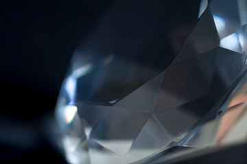 Diamond elements close-up on a black background. Abstraction. Defocused.