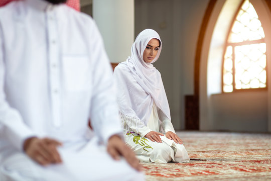 Muslim Praying man and woman in mosque