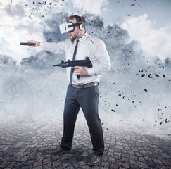 Naklejka premium Businessman is playing a game wearing virtual reality glasses and holding a gun