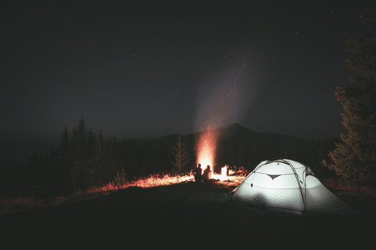 camping tent in the woods at night