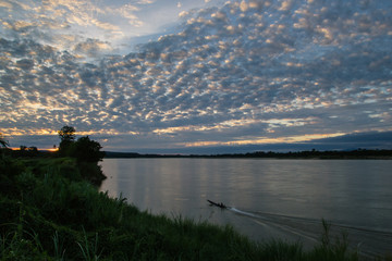 Atmosphere sunset at the Mekong river is bordered by Thailand and Laos