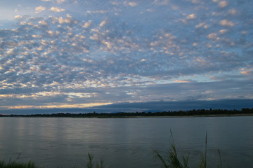 Atmosphere sunset at the Mekong river is bordered by Thailand and Laos