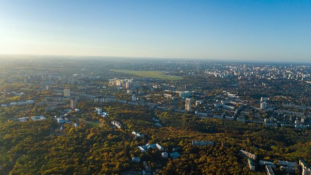 Golden autumn Kyiv cityscape, aerial drone view of city skyline and forest with yellow trees and beautiful landscape from above, Kiev, Goloseevo forest, Ukraine © Iuliia Sokolovska