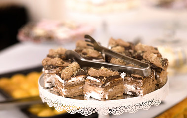 Table with of chocolate cakes on a stand