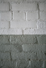 Abstract weathered texture stained old stucco light gray and aged paint white brick wall background in rural room, grungy rusty blocks of stonework technology color horizontal architecture wallpaper